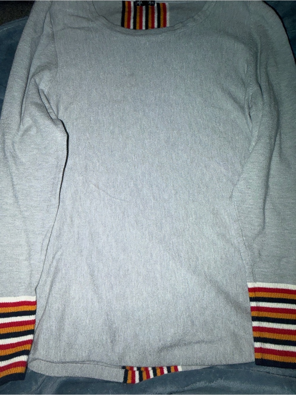 Hannah Light Gray Crewneck Sweater with Red, Yellow & Black Striped Cuffs